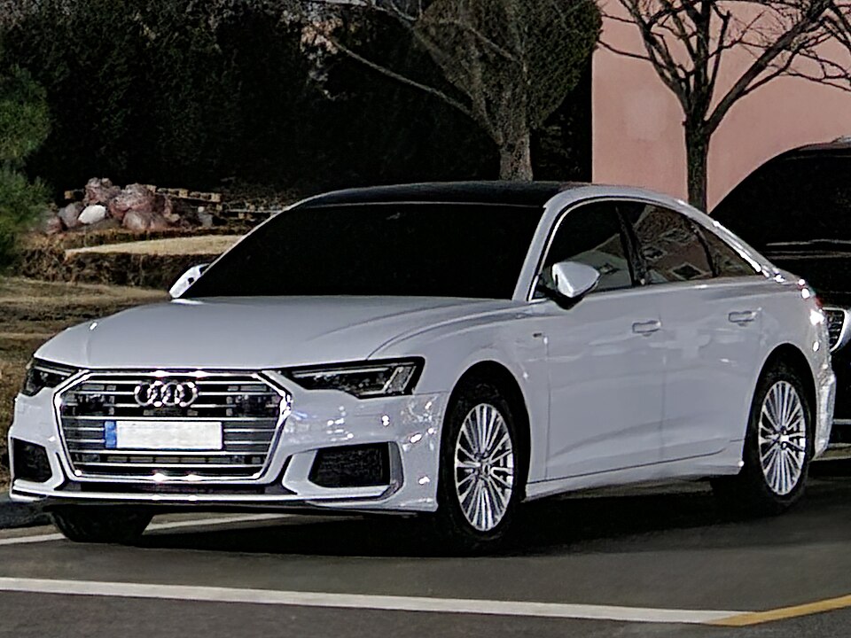 White Audi luxury sedan available for wedding and barat booking — QuickAura Travels